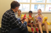 Teacher explaining kids about educational toys